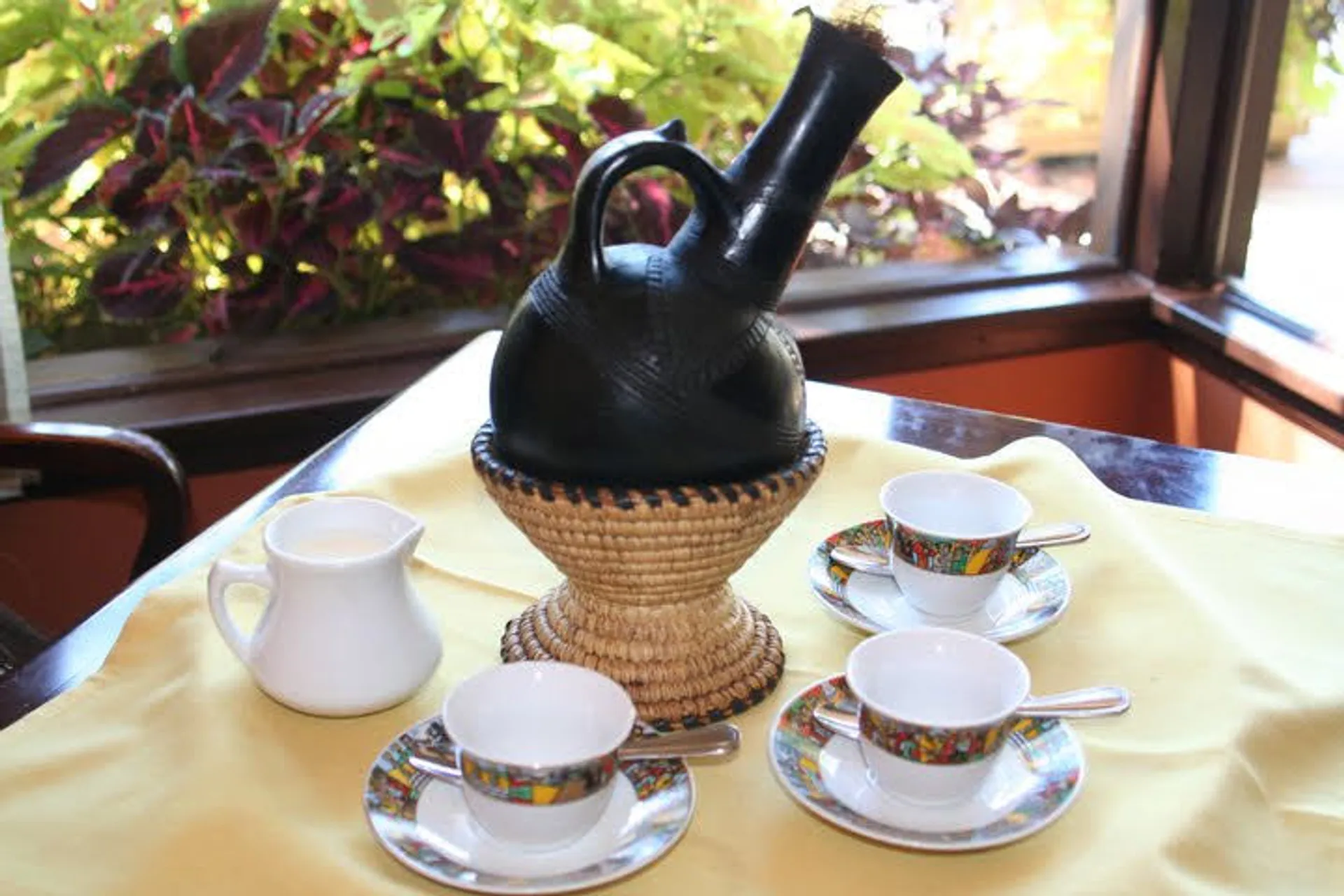 Ethiopian coffee poured from a jebena at Mesob